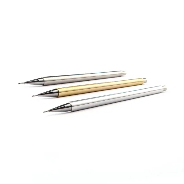 A collection of three Nicholas Hemingway handmade mechanical pencils in stainless steel, brass, and aluminium, showcasing their precision technical nibs and hand-turned bodies.